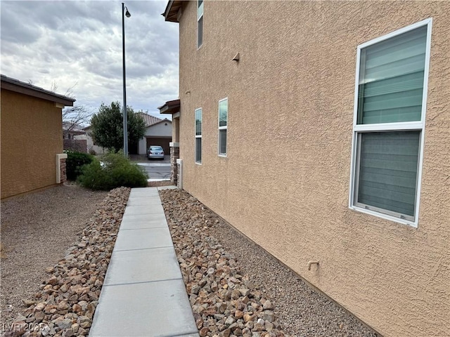 view of home's exterior with stucco siding