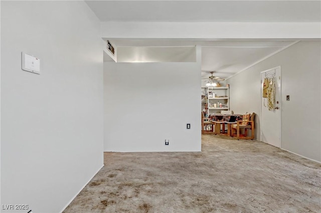 carpeted empty room with visible vents and a ceiling fan