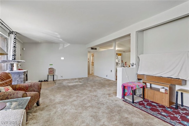 living room with visible vents and carpet