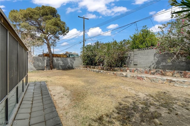 view of yard with a fenced backyard