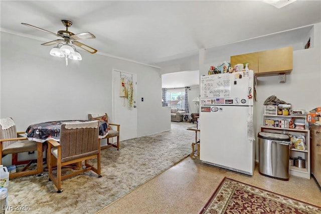 kitchen featuring freestanding refrigerator and a ceiling fan