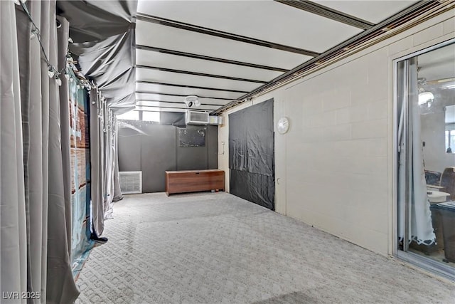 basement featuring carpet floors and visible vents