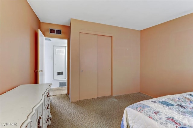 bedroom with a closet, carpet flooring, and visible vents