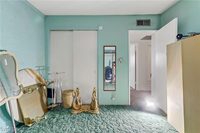 interior space featuring visible vents and a closet