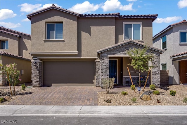 4436 Mural Glen Ct, North Las Vegas, NV 89084 - view of front of home with a tiled roof, an attached garage, stucco siding, and stone siding