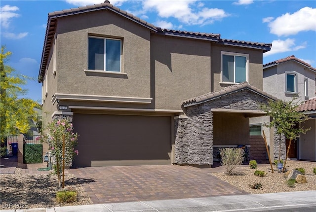 4436 Mural Glen Ct, North Las Vegas, NV 89084 - view of front of property with a garage, stucco siding, stone siding, and a tile roof