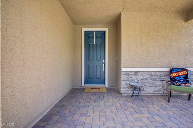 4436 Mural Glen Ct, North Las Vegas, NV 89084 - doorway to property with stone siding and stucco siding