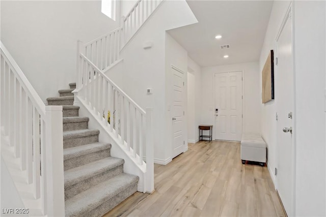 4436 Mural Glen Ct, North Las Vegas, NV 89084 - entrance foyer with baseboards, light wood-type flooring, stairs, and visible vents