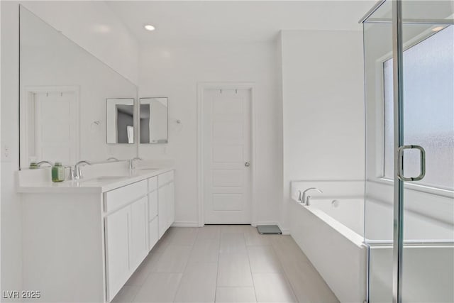 4436 Mural Glen Ct, North Las Vegas, NV 89084 - full bath featuring double vanity, tile patterned flooring, a sink, and a bath