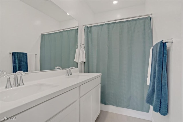 4436 Mural Glen Ct, North Las Vegas, NV 89084 - full bathroom featuring double vanity, a sink, and a shower with shower curtain