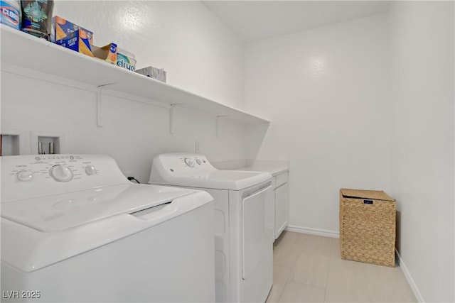 4436 Mural Glen Ct, North Las Vegas, NV 89084 - laundry room with baseboards, cabinet space, and washer and dryer