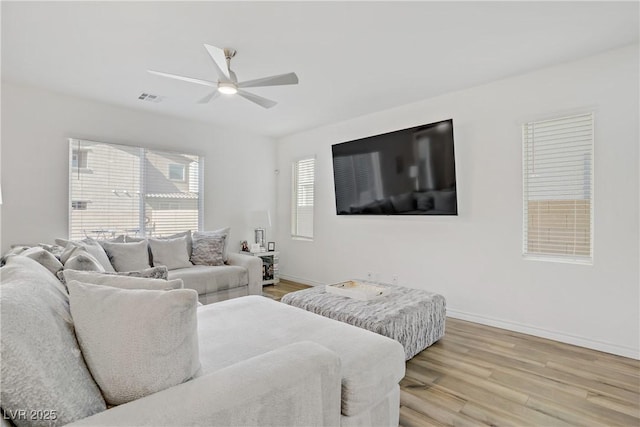 4436 Mural Glen Ct, North Las Vegas, NV 89084 - living area with a ceiling fan, baseboards, and light wood-type flooring