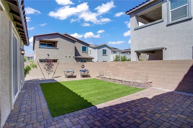 4436 Mural Glen Ct, North Las Vegas, NV 89084 - view of yard featuring a patio, a fenced backyard, and a residential view