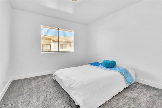 bedroom with carpet flooring and baseboards
