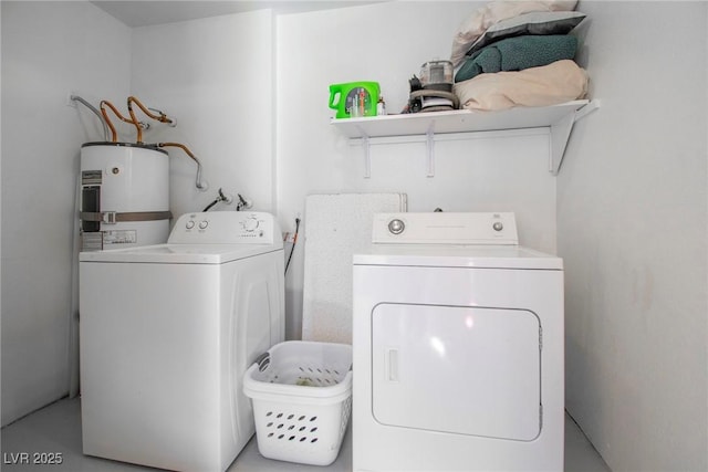 laundry area featuring water heater and independent washer and dryer