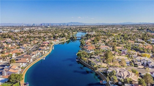 aerial view of residential area with a water and mountain view