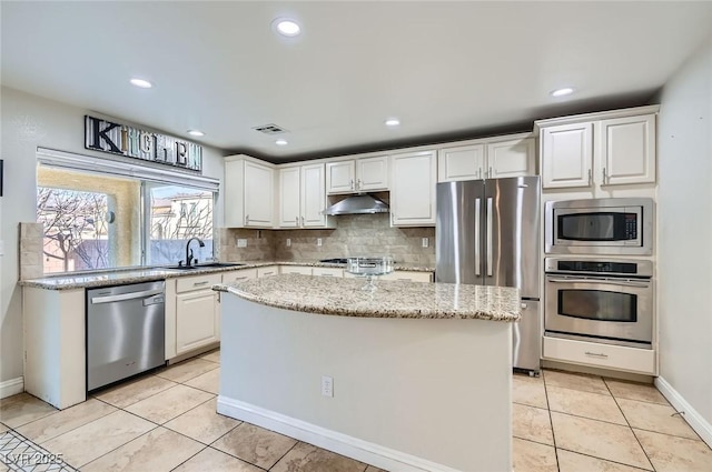 kitchen with white cabinetry, appliances with stainless steel finishes, a sink, and visible vents