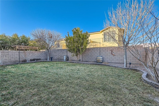view of yard featuring a fenced backyard