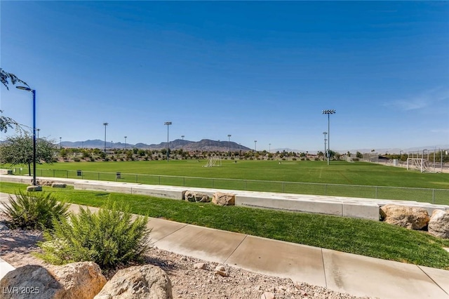 489 Filaree Pl, Henderson, NV 89015 - surrounding community with a mountain view and fence