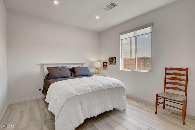bedroom with visible vents, recessed lighting, light wood finished floors, and baseboards