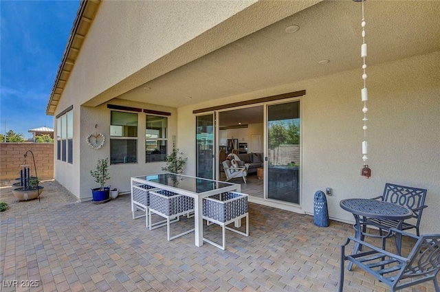 view of patio featuring fence