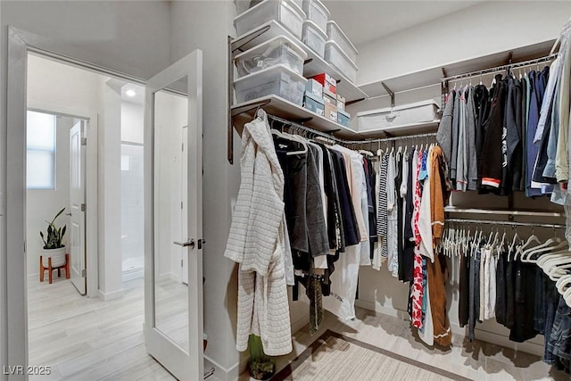 spacious closet with wood finished floors
