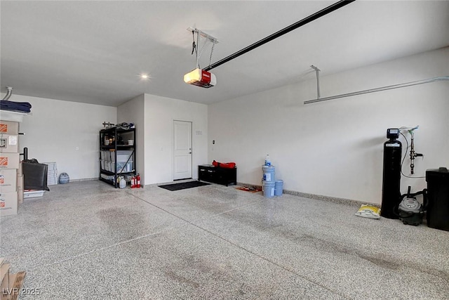 garage featuring recessed lighting and a garage door opener