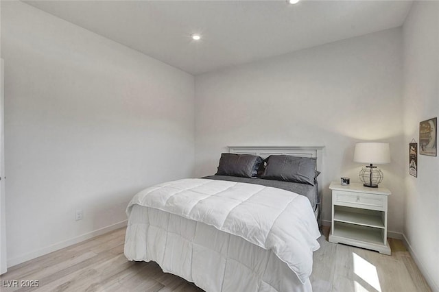 bedroom with recessed lighting, baseboards, and light wood-type flooring