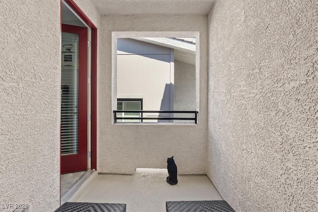 143 Aqua Commons Ln, Henderson, NV 89015 - entrance to property featuring a balcony and stucco siding