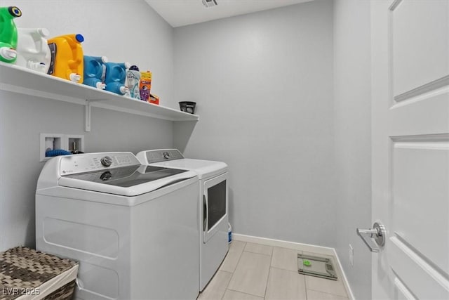 143 Aqua Commons Ln, Henderson, NV 89015 - laundry room with separate washer and dryer, baseboards, and light tile patterned flooring