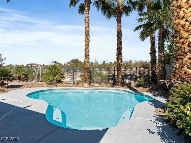 view of swimming pool with fence, a fenced in pool, and a patio