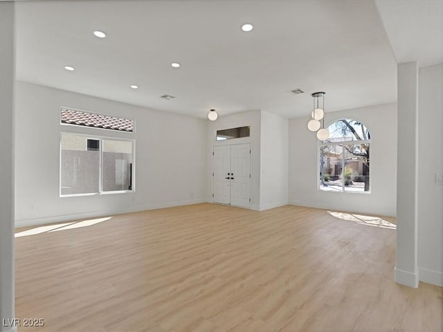 spare room with recessed lighting, baseboards, visible vents, and light wood-style flooring