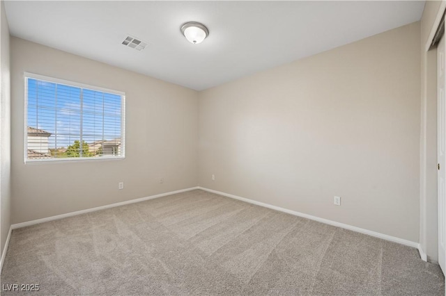 unfurnished room featuring visible vents, baseboards, and carpet floors