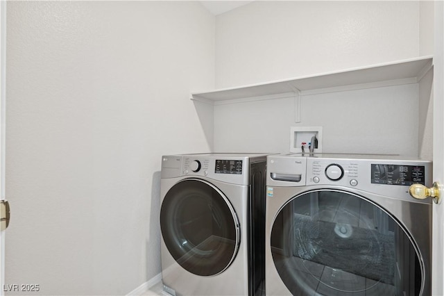 laundry room with laundry area, baseboards, and washing machine and clothes dryer