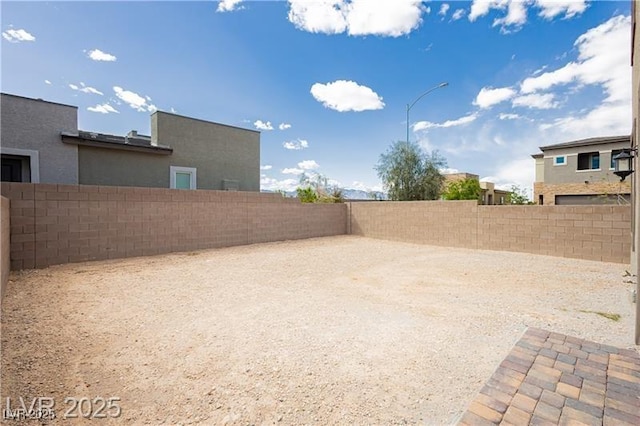 view of yard with a fenced backyard