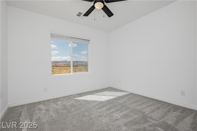 empty room featuring baseboards, carpet, a ceiling fan, and visible vents