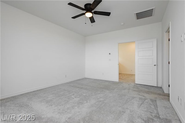 unfurnished bedroom featuring carpet flooring, a ceiling fan, baseboards, and visible vents