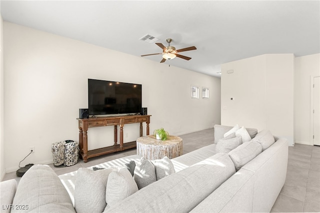 living area with visible vents, ceiling fan, and light tile patterned floors