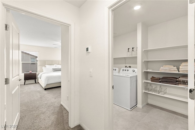 laundry room featuring independent washer and dryer, laundry area, and baseboards