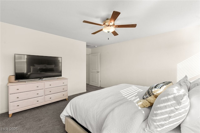 bedroom with baseboards, a ceiling fan, and dark carpet