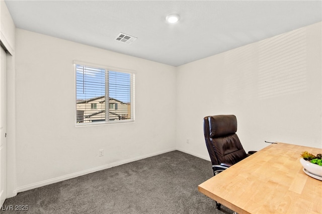 carpeted office with baseboards and visible vents