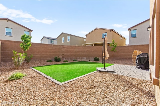 view of yard with a patio and a fenced backyard