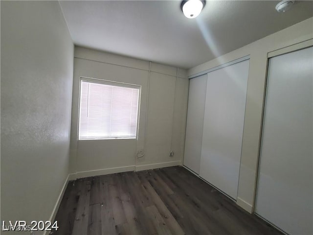 1317 Exley Ave, Las Vegas, NV 89104 - unfurnished bedroom featuring baseboards and wood finished floors