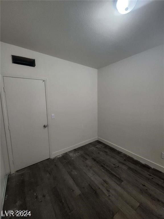 1317 Exley Ave, Las Vegas, NV 89104 - spare room with baseboards and dark wood finished floors
