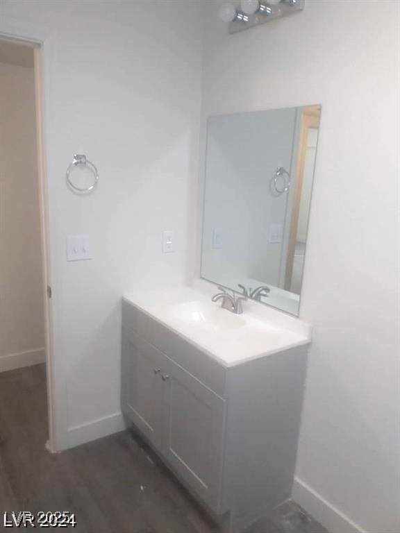 1317 Exley Ave, Las Vegas, NV 89104 - bathroom with baseboards and vanity