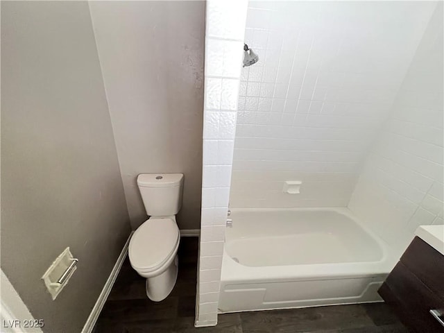 full bathroom featuring bathing tub / shower combination and toilet