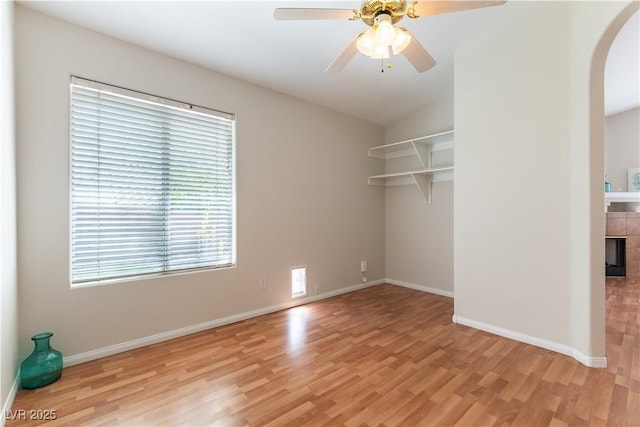 3510 Judah Way, Las Vegas, NV 89147 - unfurnished room featuring light wood-style floors, arched walkways, baseboards, and ceiling fan