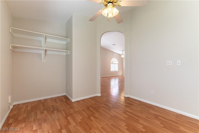 3510 Judah Way, Las Vegas, NV 89147 - unfurnished room with arched walkways, ceiling fan, baseboards, and wood finished floors