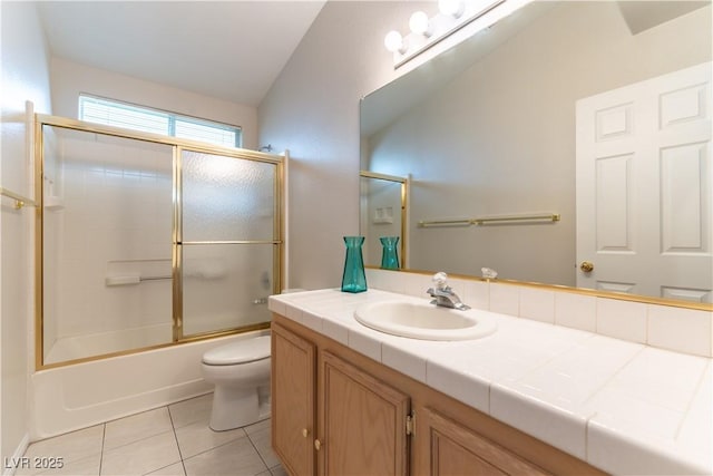 3510 Judah Way, Las Vegas, NV 89147 - full bathroom with tile patterned flooring, vanity, toilet, vaulted ceiling, and bath / shower combo with glass door