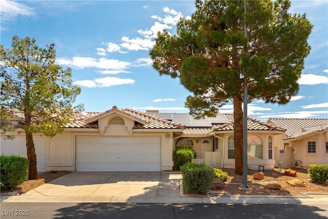 3510 Judah Way, Las Vegas, NV 89147 - view of front facade with a garage, roof mounted solar panels, stucco siding, and driveway